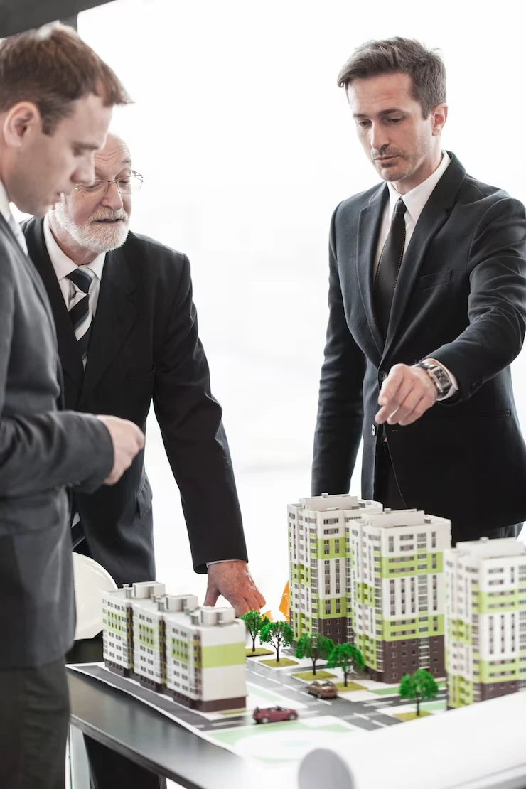 Property investment advisors examining detailed development models to plan portfolio expansion strategy
